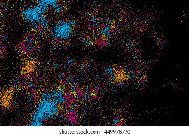 Abstract background, falling confetti. Many random tiny glitter pieces. Golden, red, blue and violet glitter Christmas random blow patterns. Abstract sparkle glittering background. Holiday texture. 
