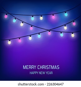 Abstract background with festive colorful Christmas lights.
