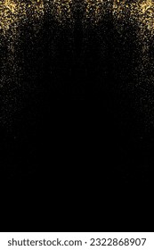 Abstract background. Gold dust. Glitters on a black background. Flying particles of golden confetti.