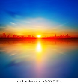 abstract background with gold spring sunrise and silhouette of city