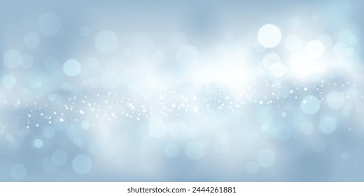 Abstract background in light blue tones with many shiny sparkles, some of which are in focus and others are blurred, creating a captivating bokeh effect.