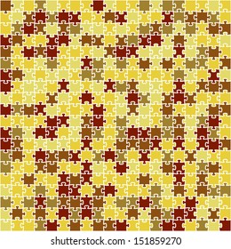 The abstract background made out of puzzle pieces in autumn colors / Red, yellow and brown puzzle background / The jigsaw background