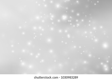 Abstract background with magic effect. Blurred defocused lights in white colors