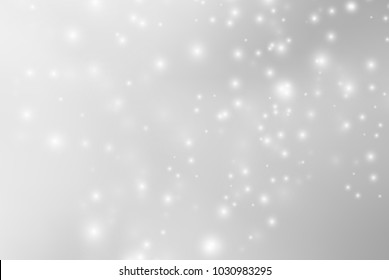 Abstract background with magic effect. Blurred defocused lights in white colors