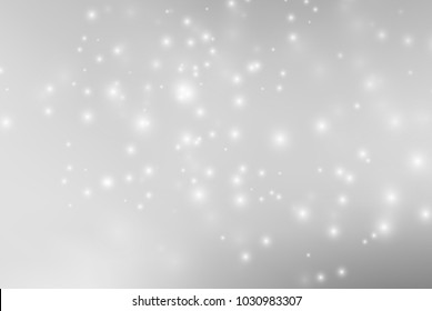 Abstract background with magic effect. Blurred defocused lights in white colors