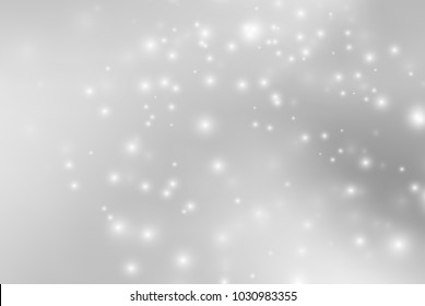 Abstract background with magic effect. Blurred defocused lights in white colors