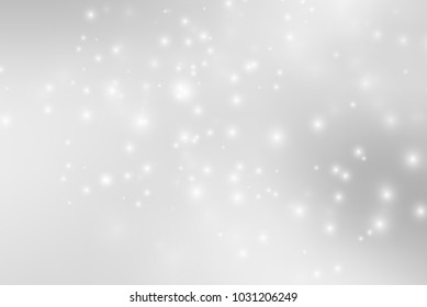 Abstract background with magic effect. Blurred defocused lights in white colors
