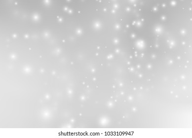 Abstract background with magic effect. Blurred defocused lights in white colors