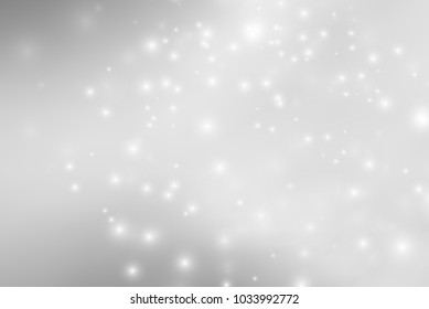 Abstract background with magic effect. Blurred defocused lights in white colors