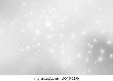 Abstract background with magic effect. Blurred defocused lights in white colors