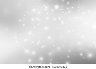 Abstract background with magic effect. Blurred defocused lights in white colors