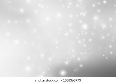 Abstract background with magic effect. Blurred defocused lights in white colors
