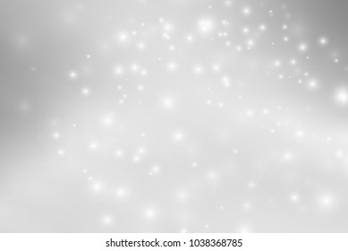 Abstract background with magic effect. Blurred defocused lights in white colors