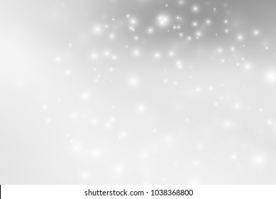 Abstract background with magic effect. Blurred defocused lights in white colors