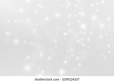 Abstract background with magic effect. Blurred defocused lights in white color