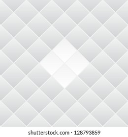 Abstract background of many grey rhombus with white rhombus in center.