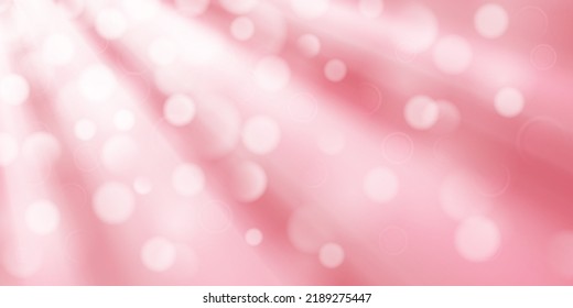 Abstract background in pink colors with diverging rays of light and small translucent circles with bokeh effect