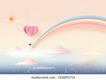 Abstract background with rainbow and paper heart balloon in pastel cloudy color rainy sky.