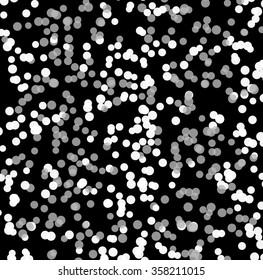 Abstract background with random, scattered circles. Grayscale, monochrome vector pattern. Spotted texture