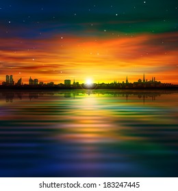 abstract background with silhouette of city and golden clouds