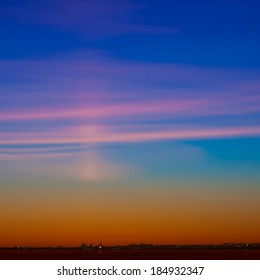 abstract background with silhouette of city and pink clouds