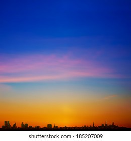 abstract background with silhouette of city and sunset