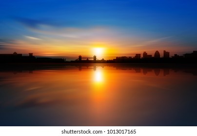 abstract background with silhouette of London and golden sunrise