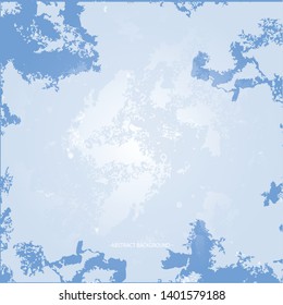 An abstract background texture resembling a winter sky in a silvery-blue haze with clouds.