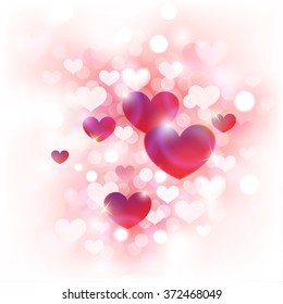 Antecedentes abstractos del Día de San Valentín con cortos corazones rosados, rojos y blancos frente a luces desenfocadas  