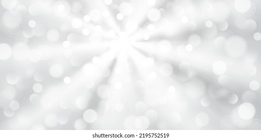 Abstract background in white and gray colors with diverging rays of light and small translucent circles with bokeh effect