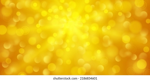 Abstract background in yellow colors with diverging rays of light and small translucent circles with bokeh effect
