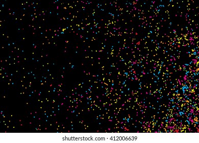 Abstract black background with falling confetti. Many round random tiny glitter pieces.