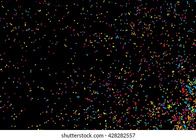 Abstract black background with falling confetti. Many round random tiny glitter pieces.