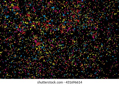 Abstract black background with falling confetti. Many round random tiny glitter pieces.