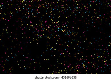 Abstract black background with falling confetti. Many round random tiny glitter pieces.