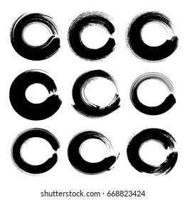 Abstract black circle textured ink strokes set isolated on a white background