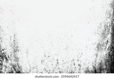 Abstract black dust and grunge texture on a white surface, creating a distressed vintage effect.