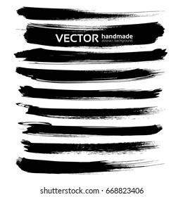 Abstract black ink brush long strokes set isolated on a white background