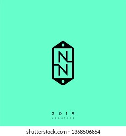 abstract black label in hexagonal shape with NN logo letter design concept and bright green background
