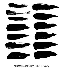 Abstract black strokes of paint  isolated on a white background