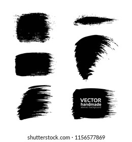 Abstract black textured smears of different forms set isolated on a white background