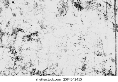 Abstract black and white grunge texture with scratches and stains, ideal for backgrounds and overlays.