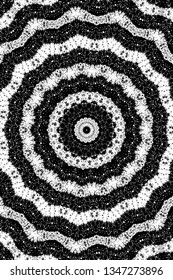 Abstract black and white painted kaleidoscopic background. Futuristic psychedelic hypnotic grunge backdrop pattern with texture. Ethnic floral ornamental mandala. Vintage geometric vector overlay