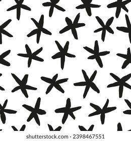 Abstract black and white starry design. Hand drawn stars ink strokes in a seamless monochrome pattern.