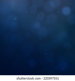 Abstract blue background with blurred bokeh bubbles