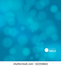 Abstract blue background with blurred bokeh bubbles