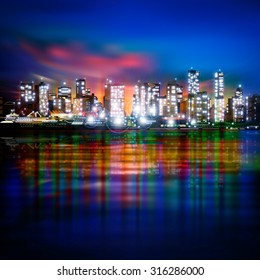 abstract blue background with panorama of illuminated city by night