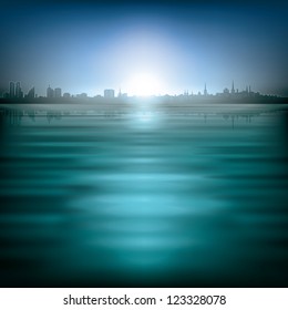 abstract blue background with silhouette of city and sunrise
