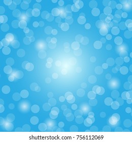 Abstract blue bokeh circles and light on blue background using for Christmas or Happy new year background, festive background with defocused light.