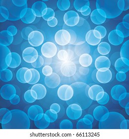 Abstract blue bokeh vector background